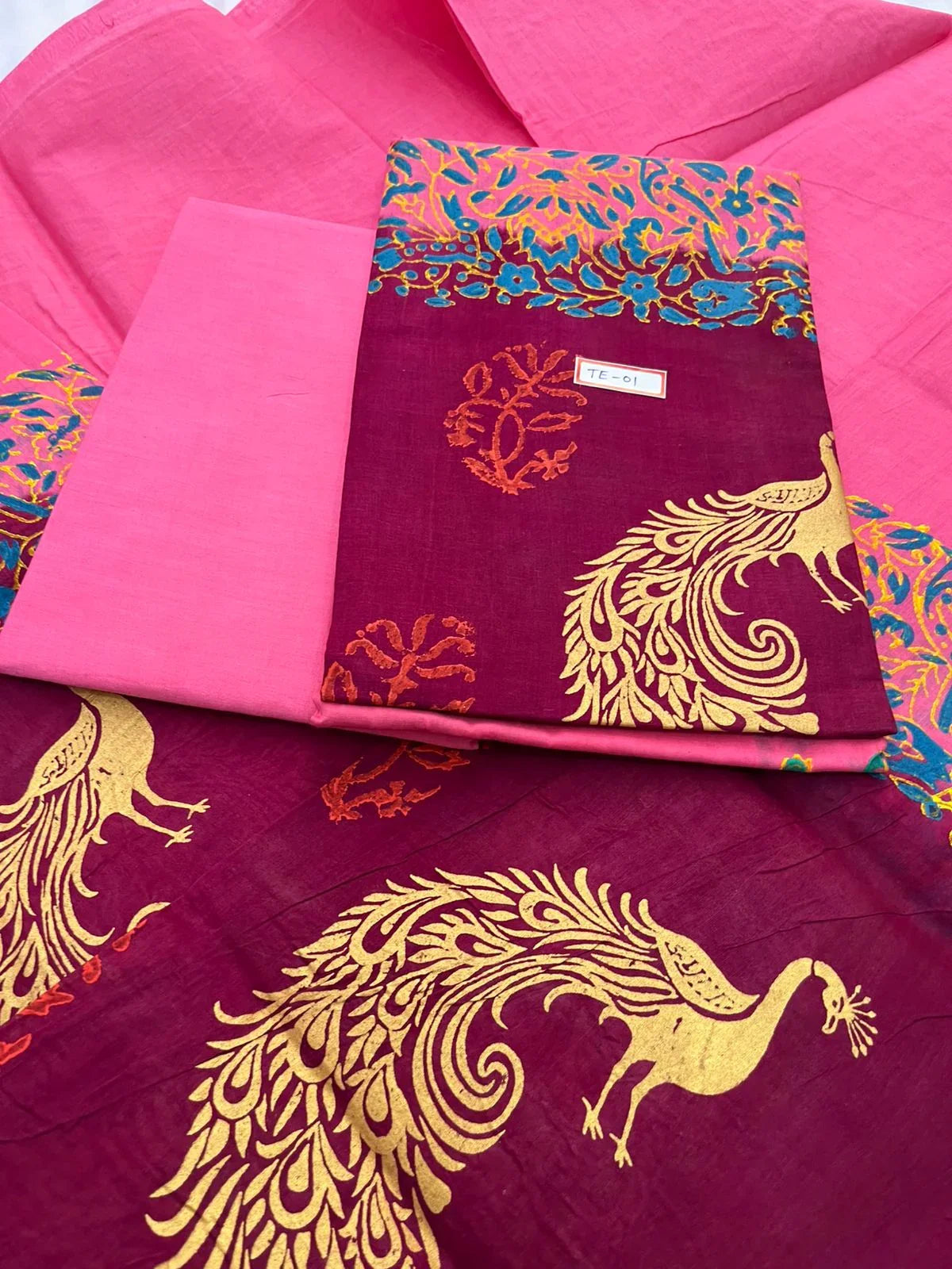 Hot Pink Colour cotton dress material featuring a beautifully crafted peacock design.