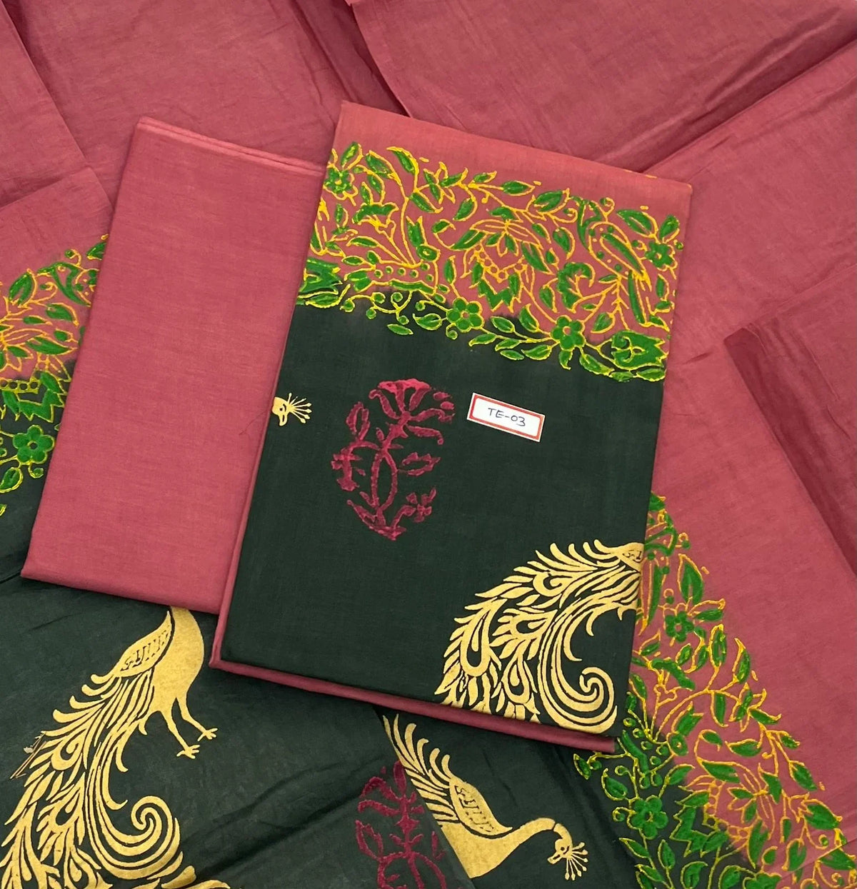 Brownish Red Colour cotton dress material featuring a beautifully crafted peacock design.