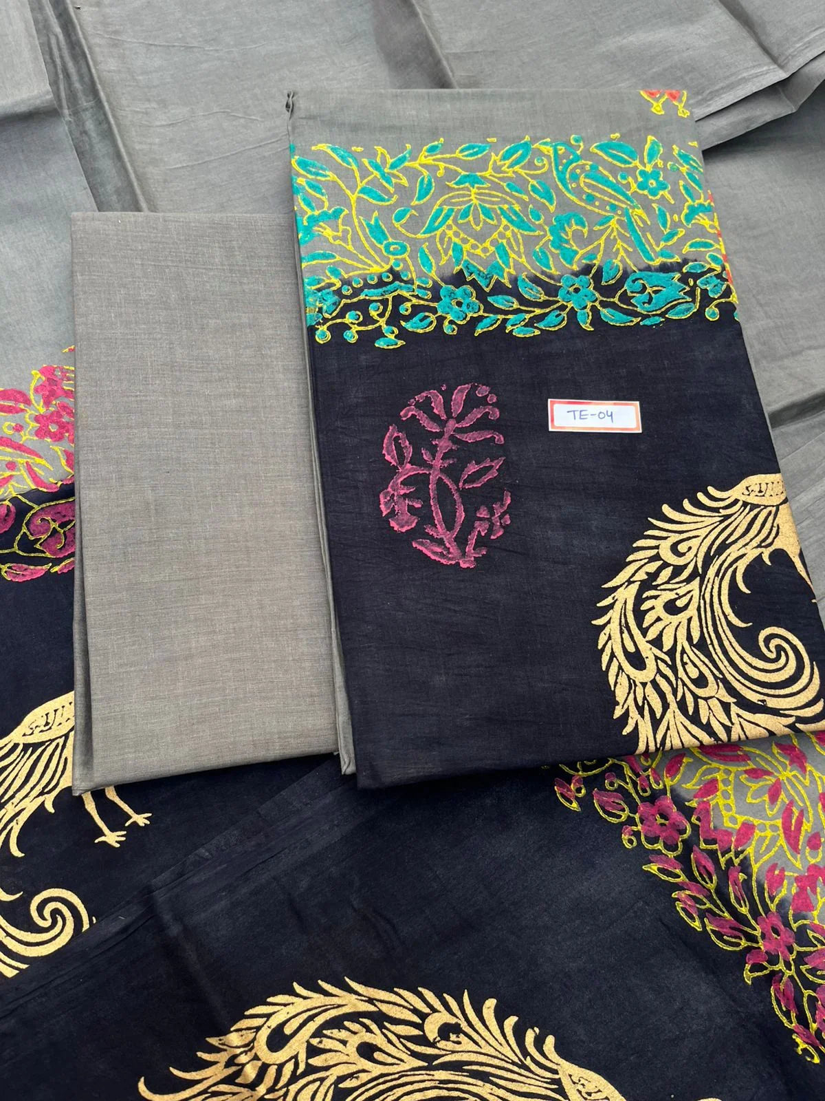 Gray Colour cotton dress material featuring a beautifully crafted peacock design.