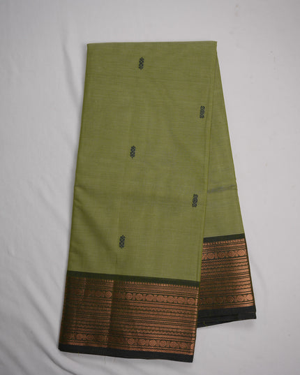 Premium Kanchi Handloom Cotton Saree in Pista Green with Traditional Black Buttas & Rich Copper Zari Border