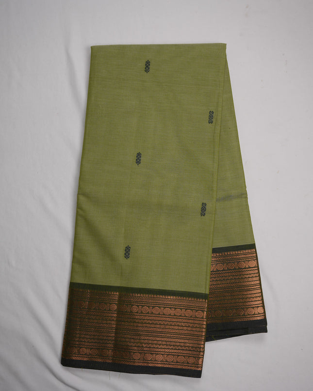Premium Kanchi Handloom Cotton Saree in Pista Green with Traditional Black Buttas & Rich Copper Zari Border