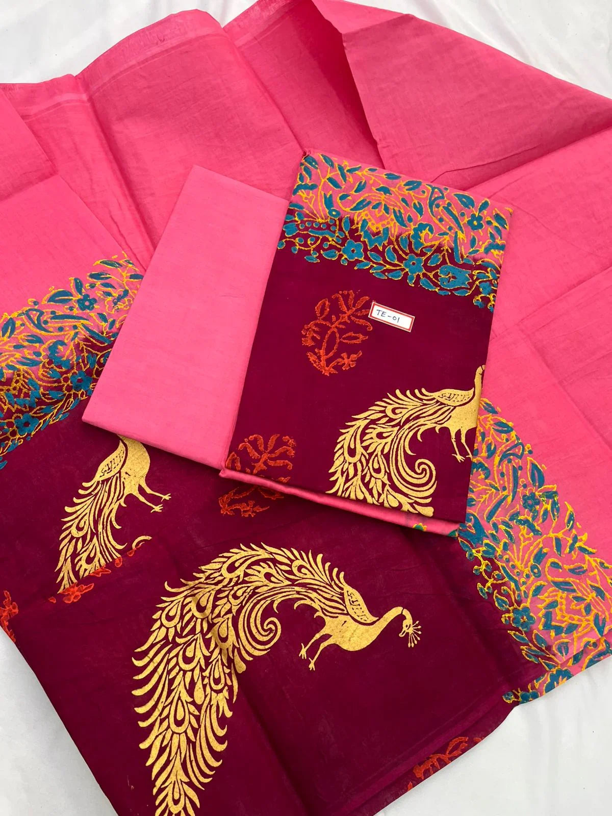 Hot Pink Colour cotton dress material featuring a beautifully crafted peacock design.