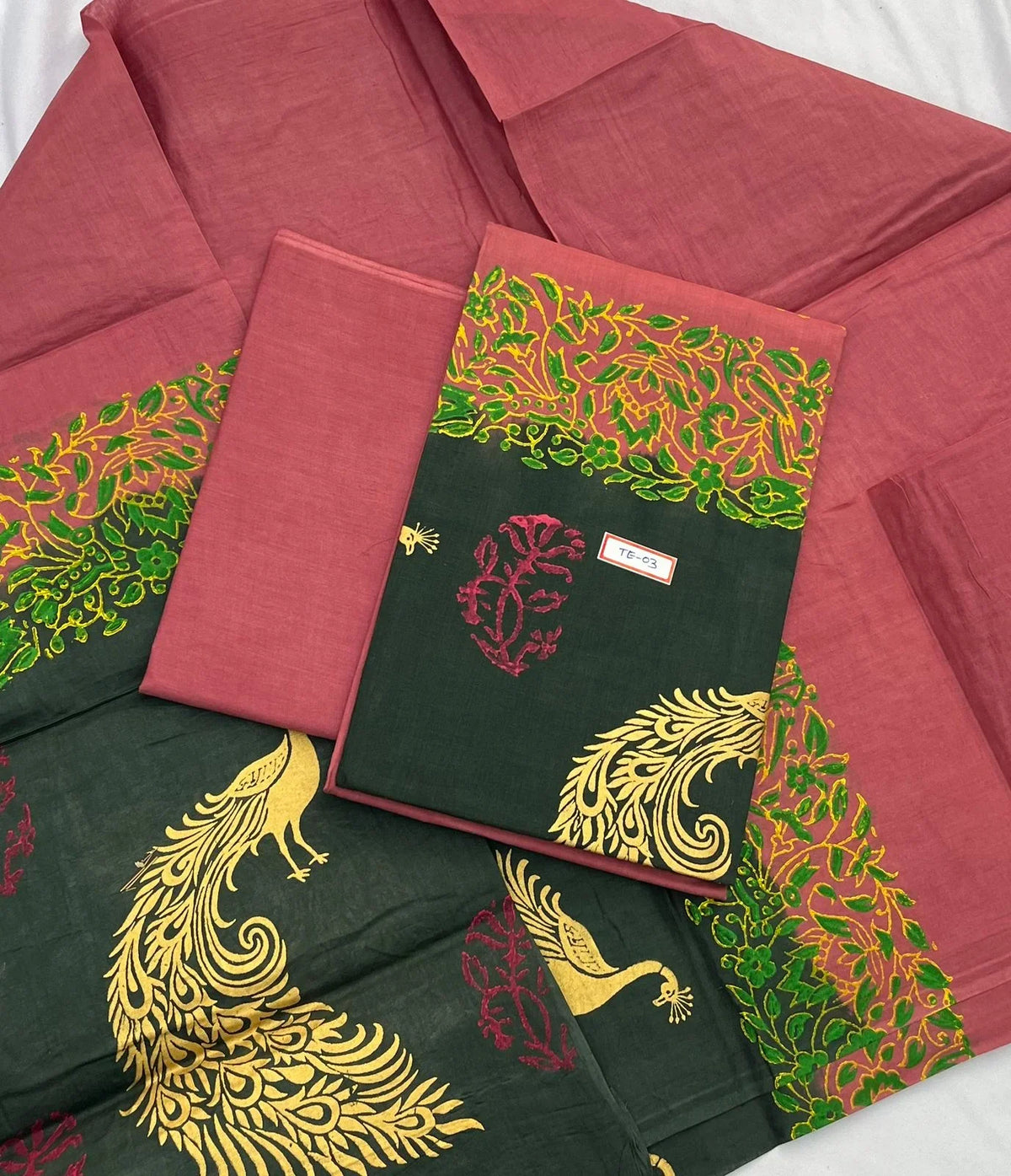 Brownish Red Colour cotton dress material featuring a beautifully crafted peacock design.
