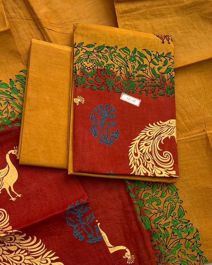 Orange Brown Colour cotton dress material featuring a beautifully crafted peacock design.