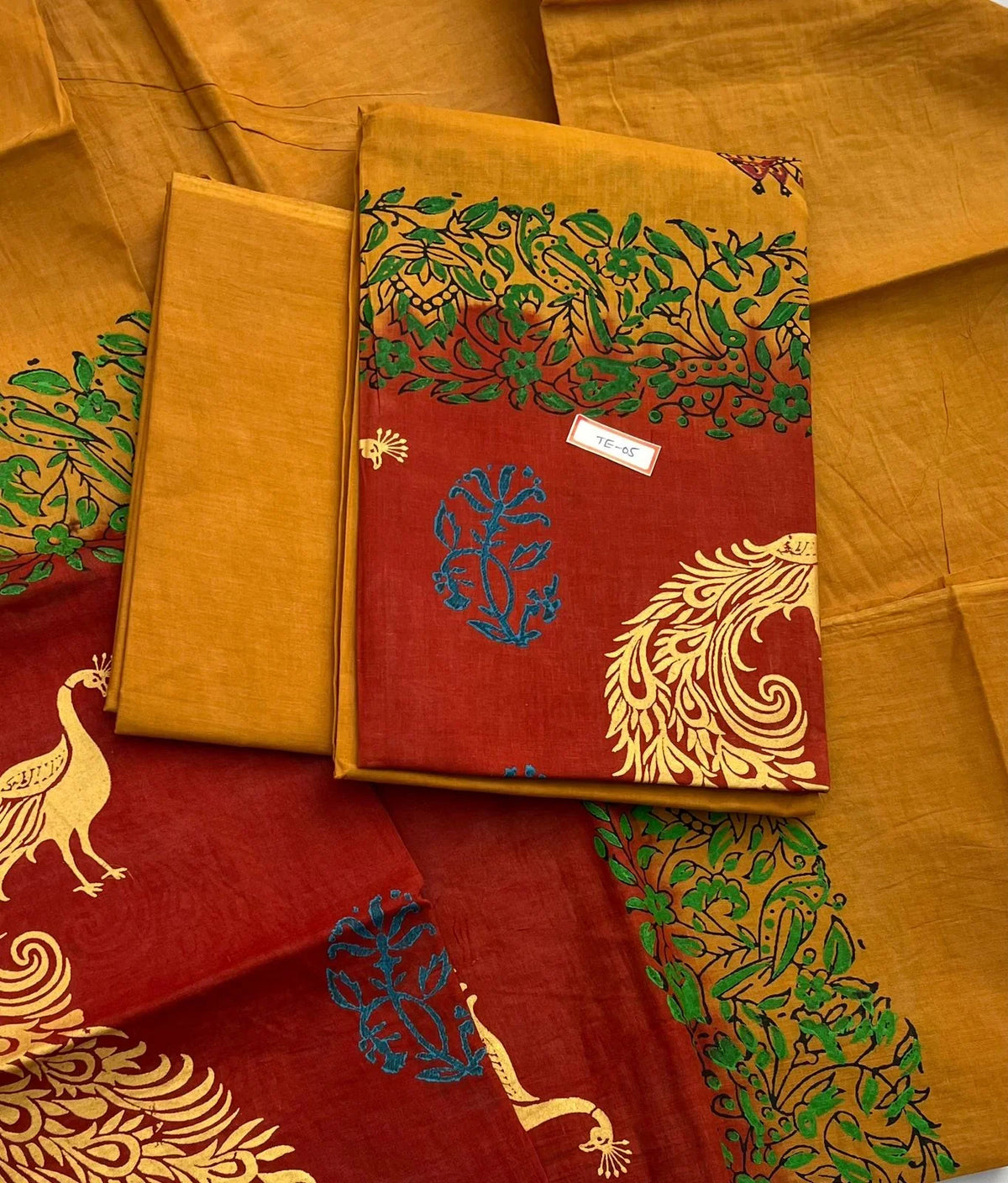 Orange Brown Colour cotton dress material featuring a beautifully crafted peacock design.
