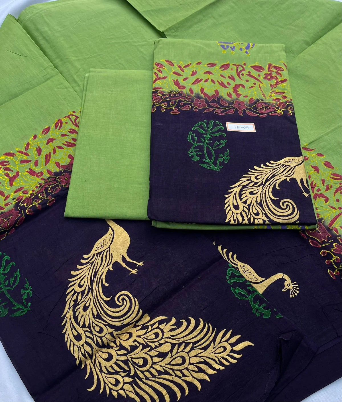 Green Colour cotton dress material featuring a beautifully crafted peacock design.