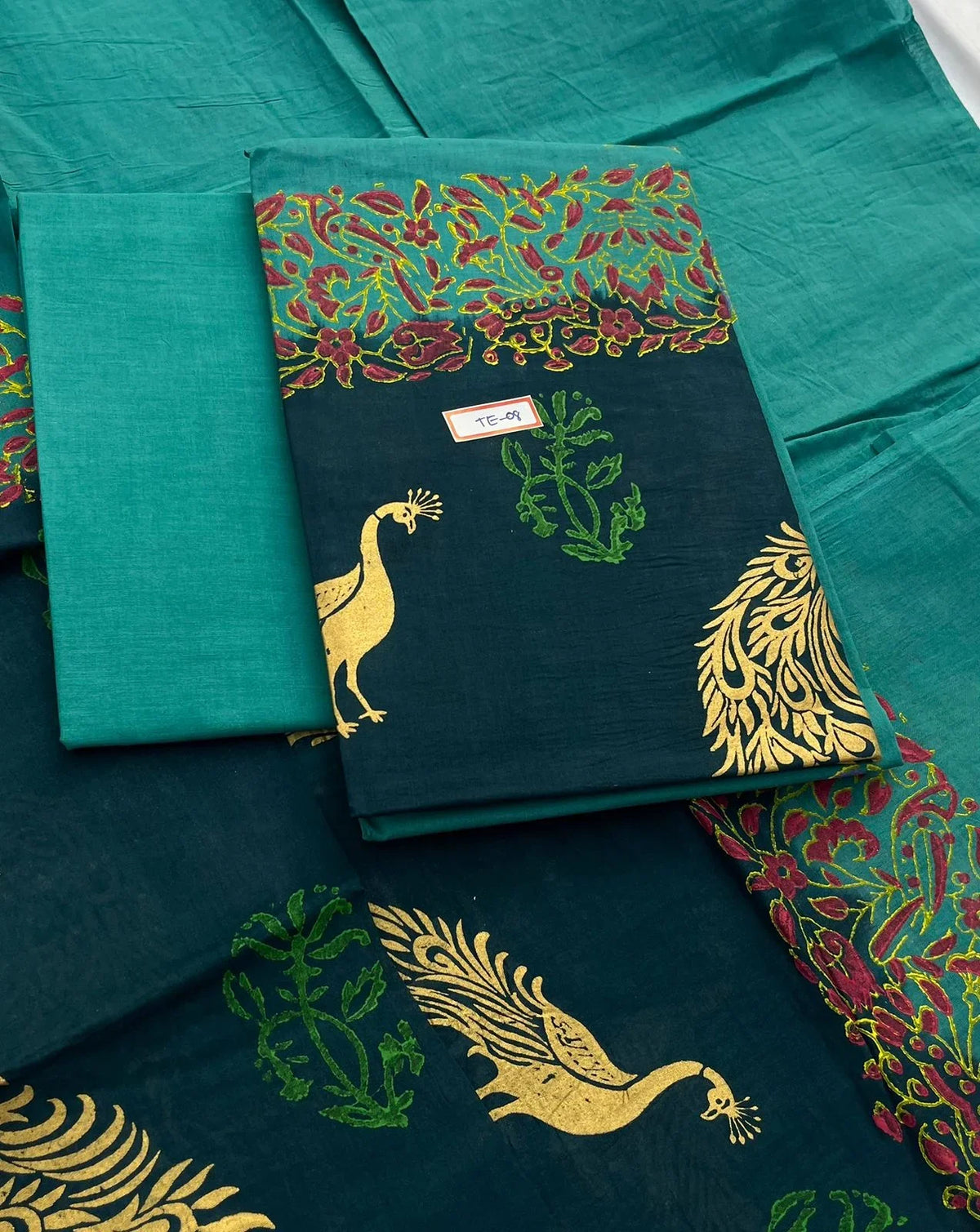 Sea Blue Colour cotton dress material featuring a beautifully crafted peacock design.