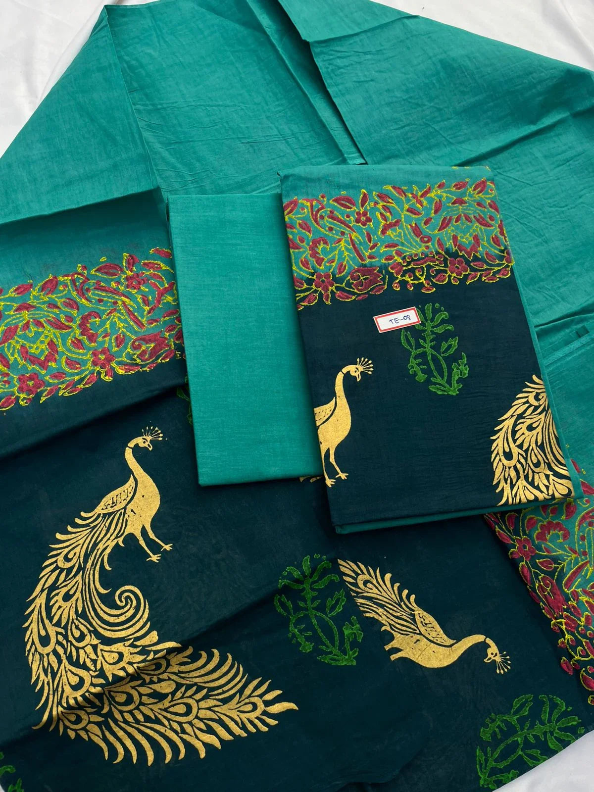 Sea Blue Colour cotton dress material featuring a beautifully crafted peacock design.