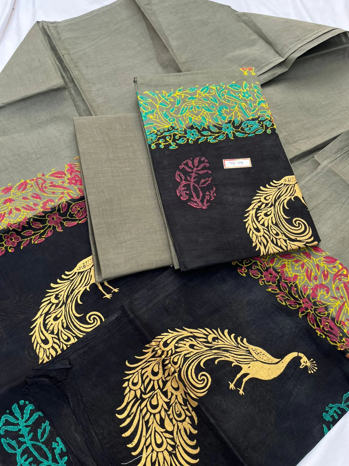 Gray Colour cotton dress material featuring a beautifully crafted peacock design.