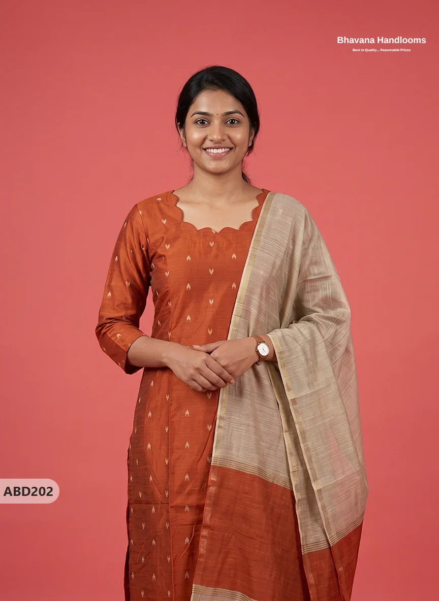 Raw Silk 3-Piece Kurti Set with Cut Work Neck Design in Burnt Rust Orange Colour | Full-Length Lined Kurti with Gold Dupatta