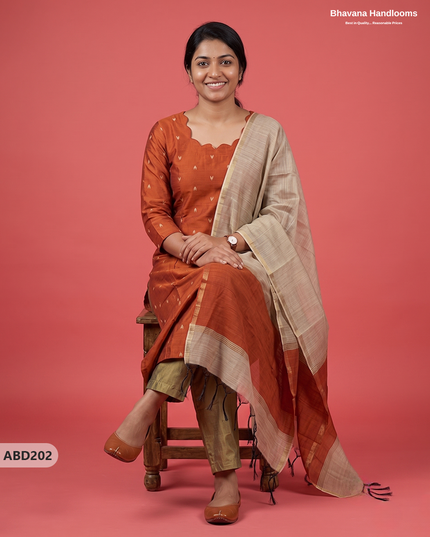 Raw Silk 3-Piece Kurti Set with Cut Work Neck Design in Burnt Rust Orange Colour | Full-Length Lined Kurti with Gold Dupatta