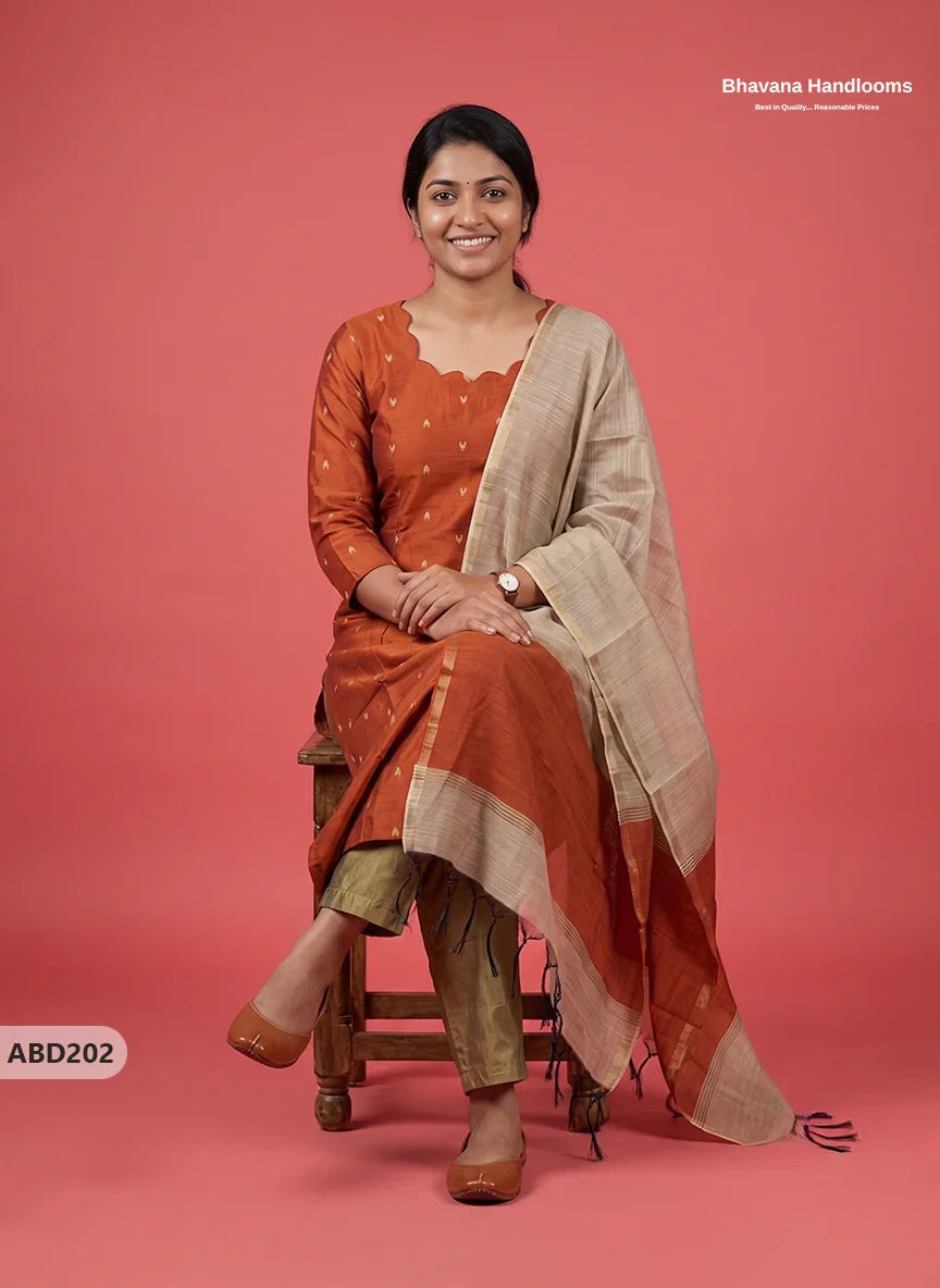 Raw Silk 3-Piece Kurti Set with Cut Work Neck Design in Burnt Rust Orange Colour | Full-Length Lined Kurti with Gold Dupatta