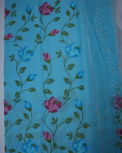 Bhavana Handlooms aqua blue silk Kota saree featuring intricate floral vine embroidery and an elegant woven border.
