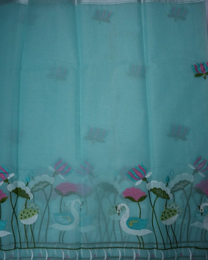 Bhavana Handlooms aqua blue silk kota saree featuring delicate swan and lotus embroidery with an elegant border.