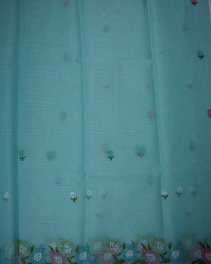 Bhavana Handlooms aqua blue silk kota saree featuring delicate floral embroidery and a multicolor designer border.