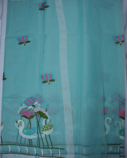 Bhavana Handlooms aqua blue silk kota saree featuring delicate swan and lotus embroidery and an elegant border.