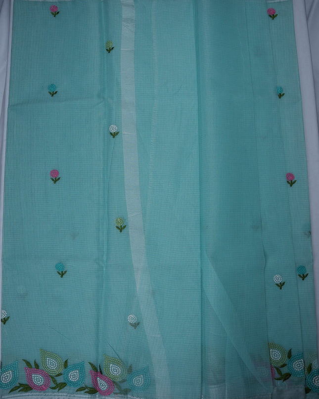 Bhavana Handlooms aqua blue silk Kota saree featuring delicate multicolor floral embroidery and a woven border.