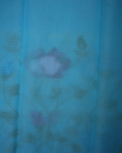 Bhavana Handlooms aqua blue silk Kota saree featuring delicate all-over floral vine embroidery and a woven border.