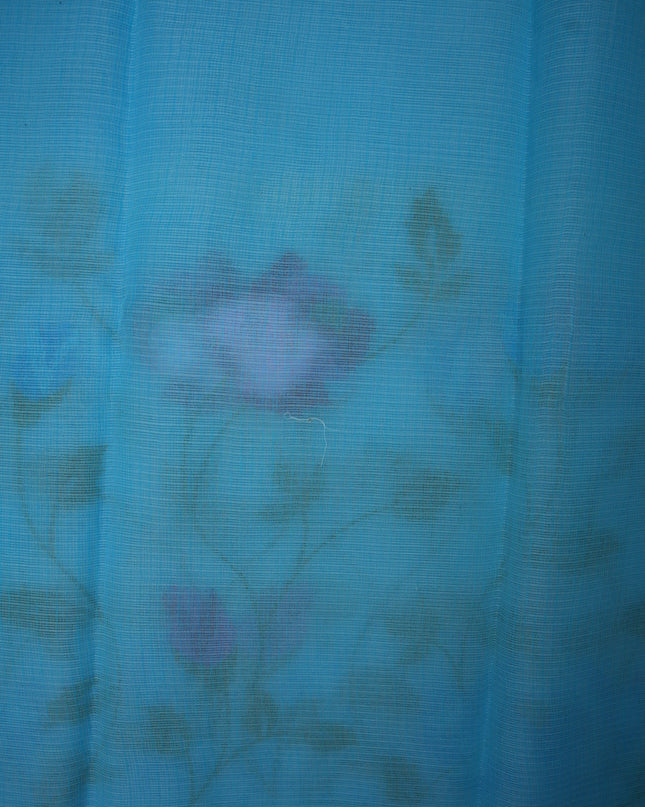 Bhavana Handlooms aqua blue silk Kota saree featuring delicate all-over floral vine embroidery and a woven border.