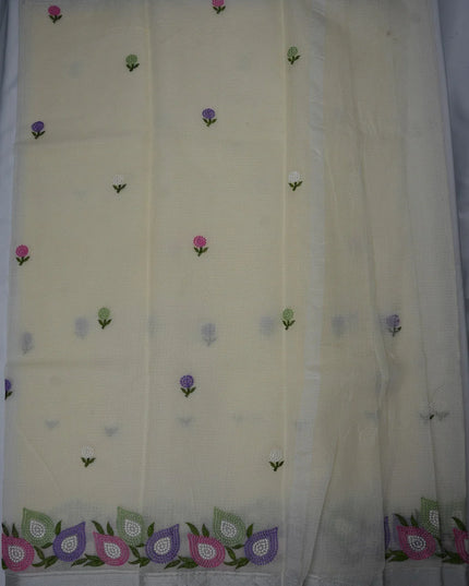 Bhavana Handlooms beige silk Kota saree featuring delicate floral embroidery motifs and a multicolor designer border.
