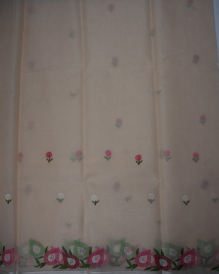 Bhavana Handlooms beige silk Kota saree featuring delicate floral embroidery motifs and a multicolor designer border.