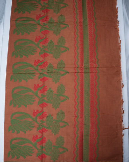 Bhavana Handlooms copper brown Coimbatore handloom saree with green peacock motifs and a contrast rani pink border.