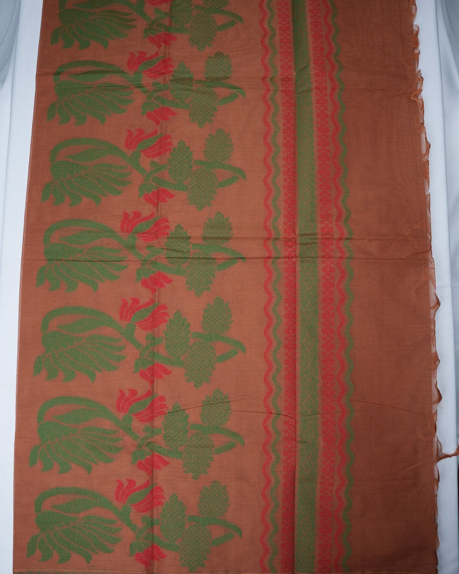 Bhavana Handlooms copper brown Coimbatore handloom saree with green peacock motifs and a contrast rani pink border.