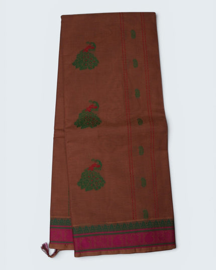 Bhavana Handlooms copper brown Coimbatore handloom saree featuring green peacock motifs and a contrast rani pink border