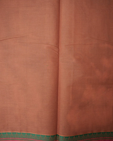 Bhavana Handlooms copper brown Coimbatore handloom saree featuring traditional peacock motifs and a rani pink border.