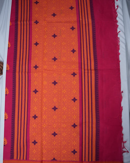 Bhavana Handlooms Coimbatore handloom saree in rani pink and orange with traditional floral butta motifs and zari border