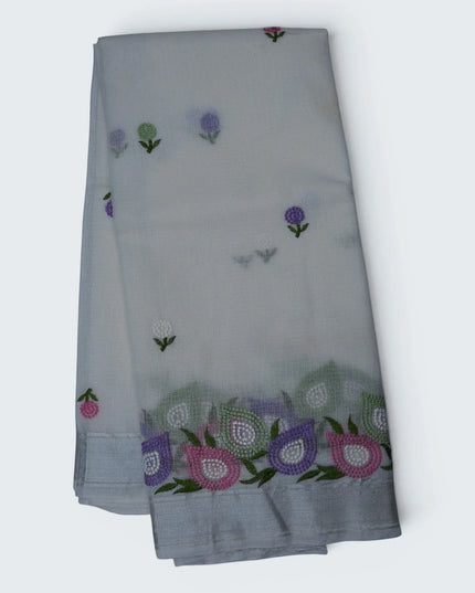 Bhavana Handlooms ivory white silk Kota saree featuring multicolor floral embroidery and an elegant silver zari border.
