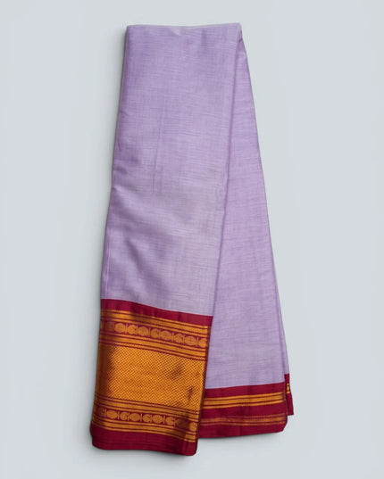 Bhavana Handlooms lavender lilac mercerized cotton saree with rich zari border and maroon trim. Lightweight and soft finish.