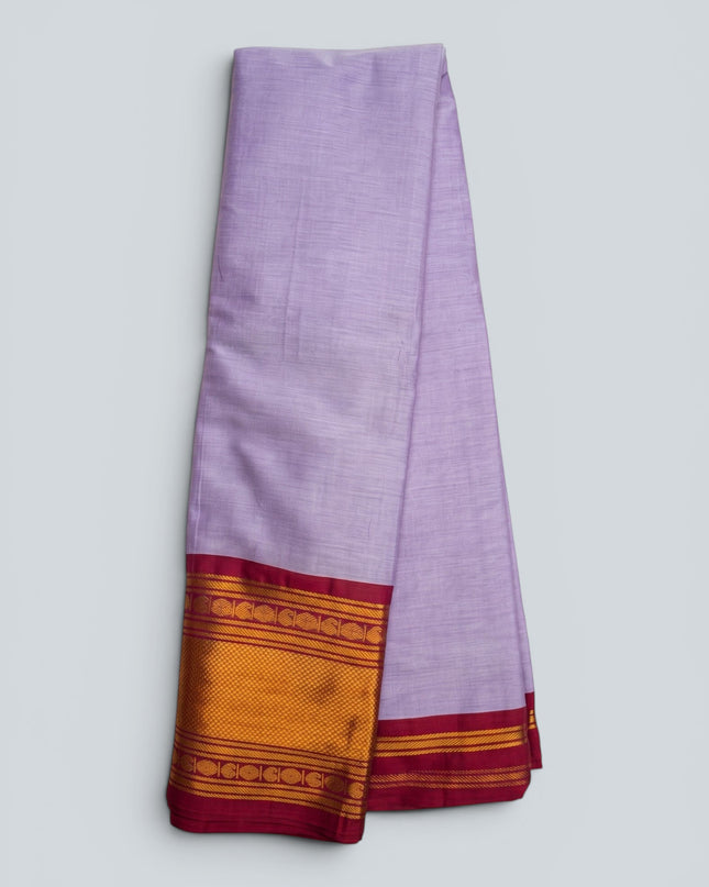 Bhavana Handlooms lavender lilac mercerized cotton saree with rich zari border and maroon trim. Lightweight and soft finish.