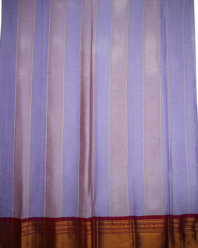 Bhavana Handlooms traditional woven cotton saree in lavender and pink stripes with a maroon and gold border.