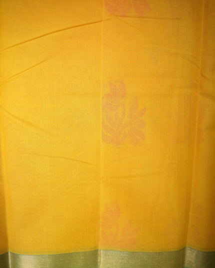 Bhavana Handlooms mustard yellow Coimbatore handloom saree featuring traditional floral motifs and aqua blue border.