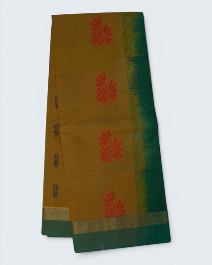 Bhavana Handlooms mustard yellow Coimbatore handloom saree featuring traditional red floral butta motifs and green border