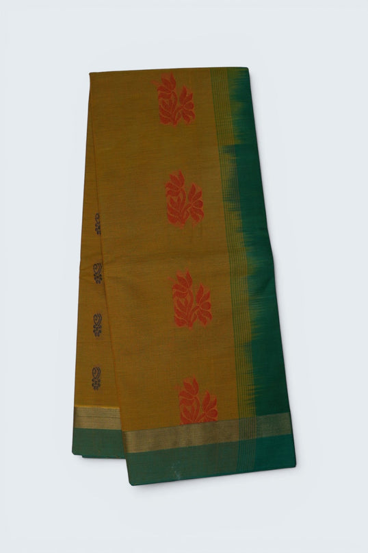 Bhavana Handlooms mustard yellow Coimbatore handloom saree featuring traditional red floral butta motifs and green border