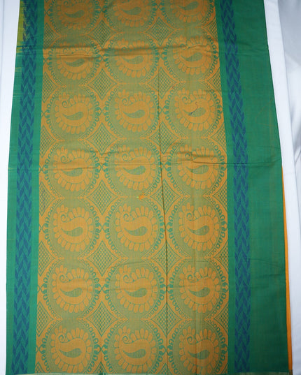 Bhavana Handlooms mustard yellow Coimbatore handloom saree featuring traditional green floral butta motifs and borders