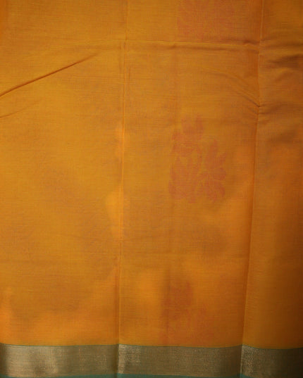 Bhavana Handlooms mustard yellow Coimbatore handloom saree featuring traditional floral butta motifs and a teal border.