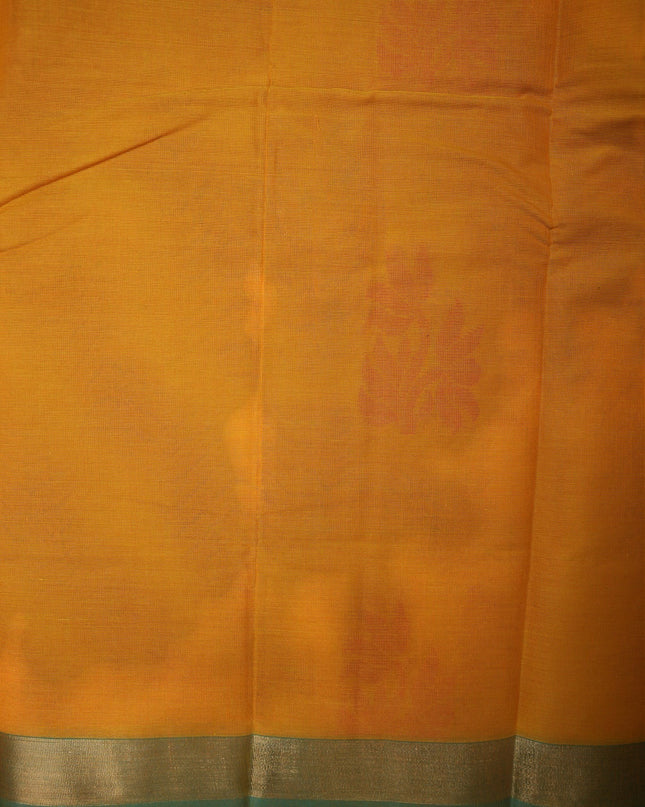 Bhavana Handlooms mustard yellow Coimbatore handloom saree featuring traditional floral butta motifs and a teal border.