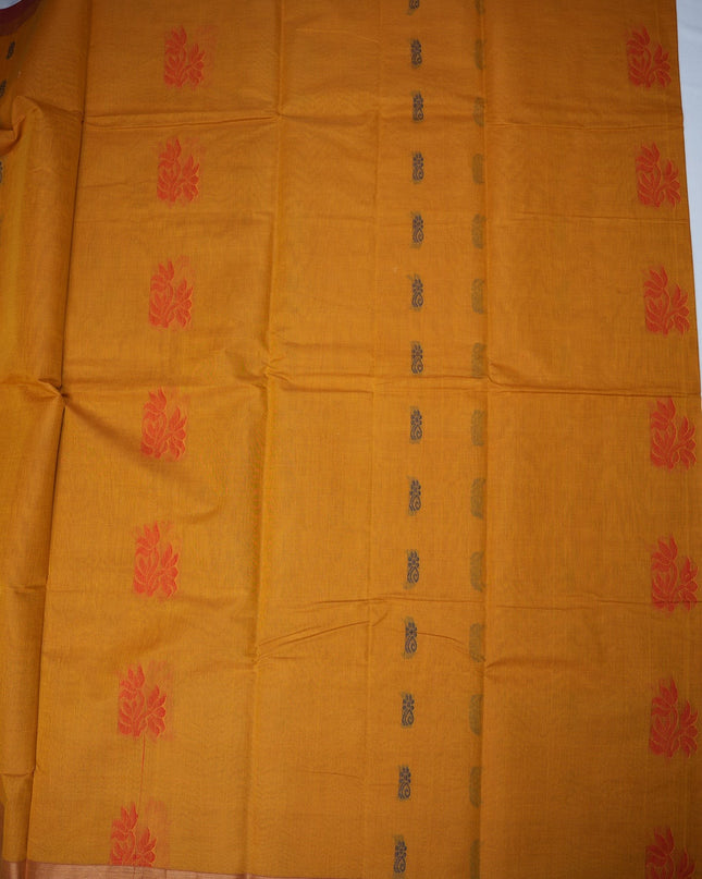 Bhavana Handlooms mustard yellow Coimbatore handloom saree with floral butta motifs and a contrast rani pink zari border