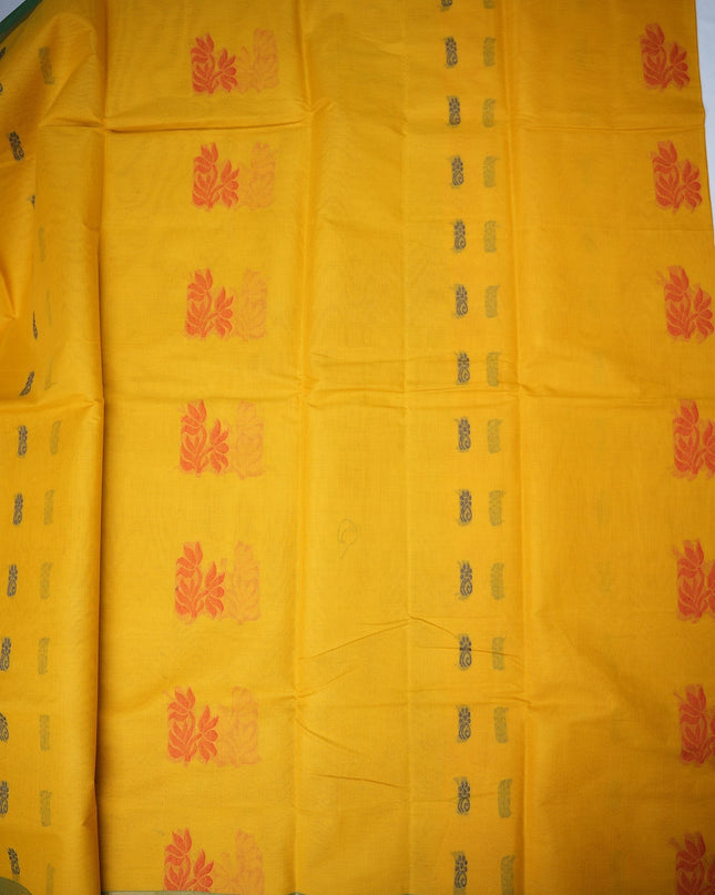 Bhavana Handlooms mustard yellow Coimbatore handloom saree with red floral motifs and a contrast aqua blue woven border.