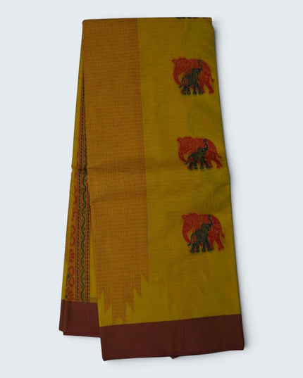 Bhavana Handlooms mustard yellow Coimbatore handloom saree featuring traditional red elephant motifs and maroon border.