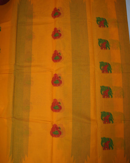 Bhavana Handlooms mustard yellow Coimbatore handloom saree featuring traditional elephant motifs and maroon border.