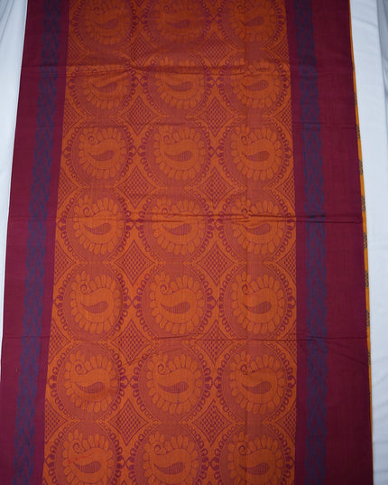 Bhavana Handlooms mustard yellow handloom saree with traditional floral butta motifs and a contrast rani pink zari border