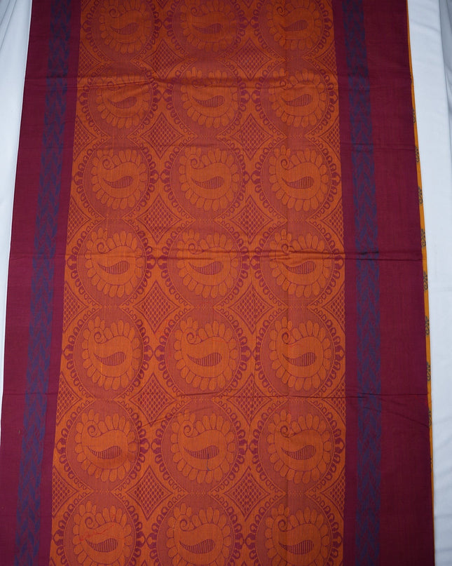 Bhavana Handlooms mustard yellow handloom saree with traditional floral butta motifs and a contrast rani pink zari border