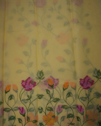 Bhavana Handlooms mustard yellow silk Kota saree featuring all-over floral embroidery and a woven border.