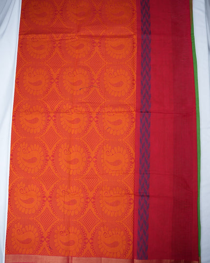 Bhavana Handlooms parrot green handloom saree featuring orange floral butta motifs and a contrast rani pink zari border