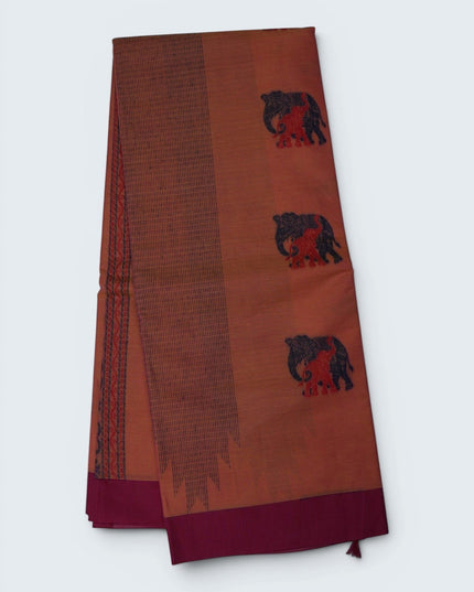 Bhavana Handlooms peach orange Coimbatore handloom saree featuring traditional elephant motifs and a rani pink border.