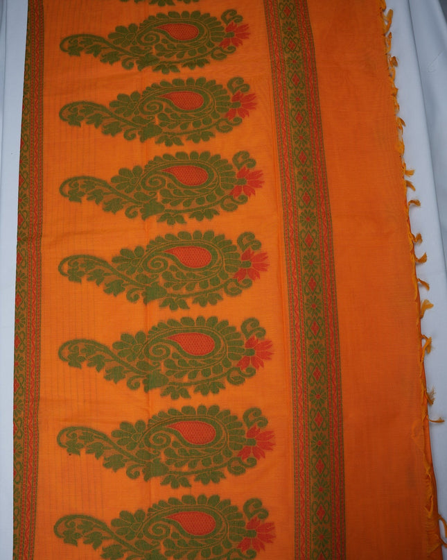 Bhavana Handlooms peach orange handloom saree featuring green paisley motifs and a contrast rani pink woven border.